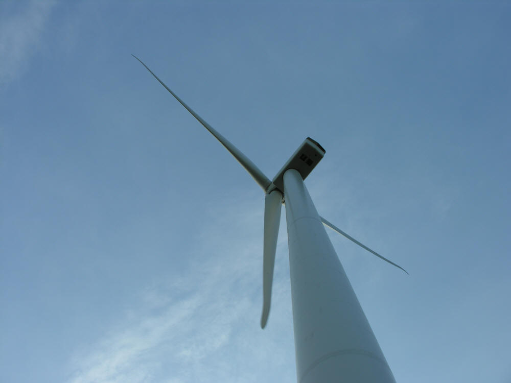 Three spinning blades of Wind turbine Collingwood, Ontario
